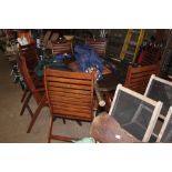 A large Outback set of teak garden furniture compr