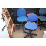 Two blue swivel office chairs
