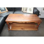 A pine two tier coffee table