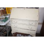A white painted bureau fitted three drawers