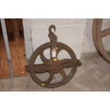 A cast iron pulley wheel