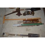 Two vintage saws, a machete, a ga