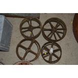 Eight small cast iron wheels