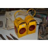 Two yellow BB and E road lamps