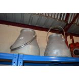 Two galvanised swing handled milking machine churns