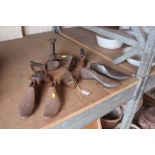 Various flat irons and cast iron shoe lasts