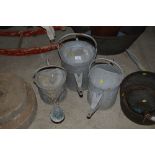 Three vintage galvanised watering cans