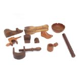 A wooden tray containing various treen items inclu