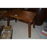 A rustic elm four legged stool