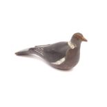 A wooden pigeon decoy