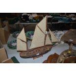 A model sailing barge