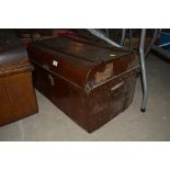 A japanned metal travelling trunk