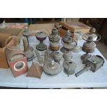 A large quantity of oil lamp bases, an old carriag