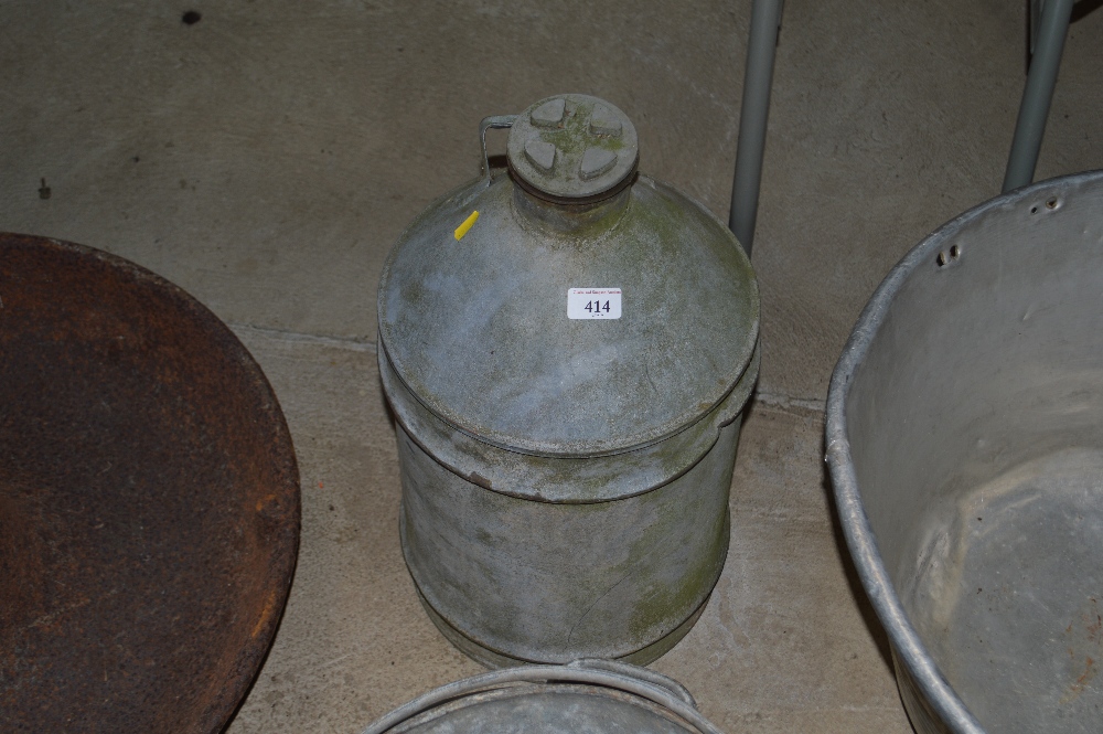 A vintage galvanised can with screw top
