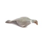 A wooden pigeon decoy