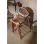 A vintage butter churn, with electric motor