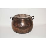 A large copper cauldron