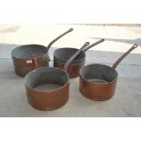 Four copper saucepans, two marked Empire Hotel