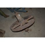 A vintage iron wheelbarrow wheel