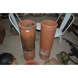 A pair of chimney pots, 35½ins high