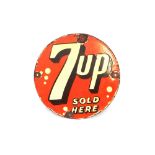 A rare red and yellow "Seven Up" circular enamel a