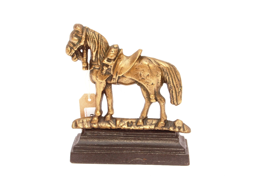 A brass and cast iron horse doorstop