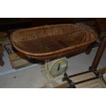 A Hughes baby weigher with wicker weighing basket