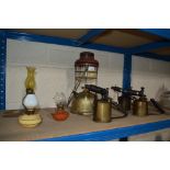 Three blow lamps, a Tilley lamp, two vintage night