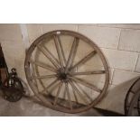 A vintage cart wheel with iron rim