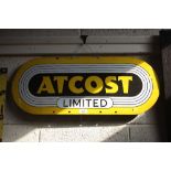An "Atcost" oval enamel advertising sign, 30ins x 12