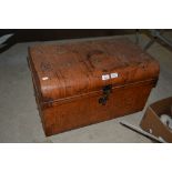 A large japanned metal travelling trunk