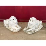 A pair of garden lion ornaments, 30ins. long