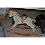 An old painted wooden rocking horse