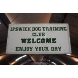 A wooden double sided Ipswich Dog Training sign