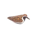 A wooden plover decoy