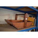 A wooden trug and contents