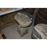 A vintage saddle stone, 29ins high