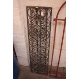 A pair of cast iron pierced grills with scroll dec