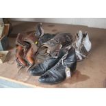 Two pairs of vintage ice skates, leather buskins a