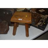 A small rustic elm four legged stool
