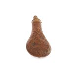 A 19th Century copper shot flask with raised decor