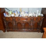 A good quality oak figural decorated sideboard fit