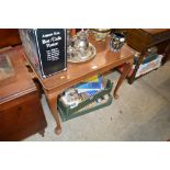 A mahogany tray topped side table raised on cabrio