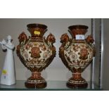 A pair of Majolica style twin handled vases