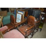 A set of eight oak and brown leather upholstered d