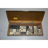 A silver plated box and contents of antique domino