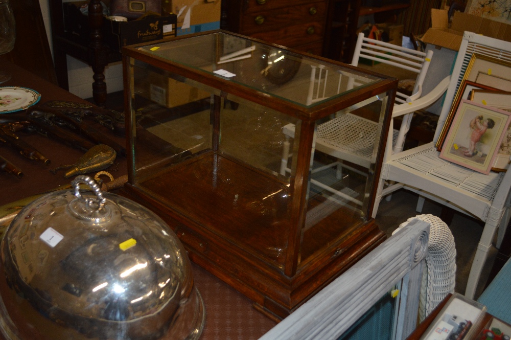 An oak and bevelled glass table top display case