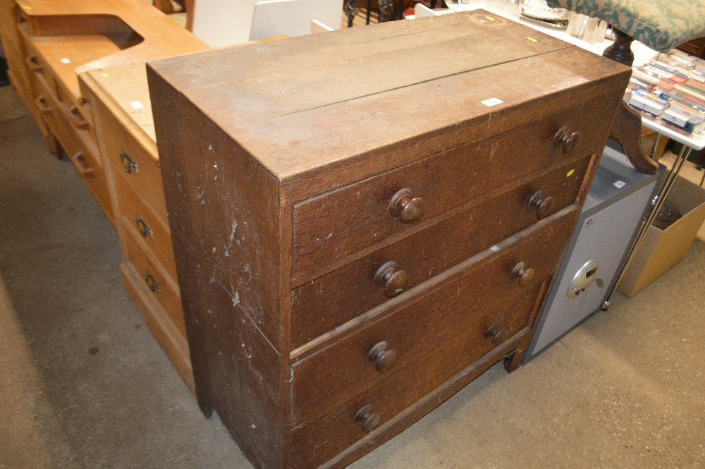 A 19th century oak chest fitted four long graduati