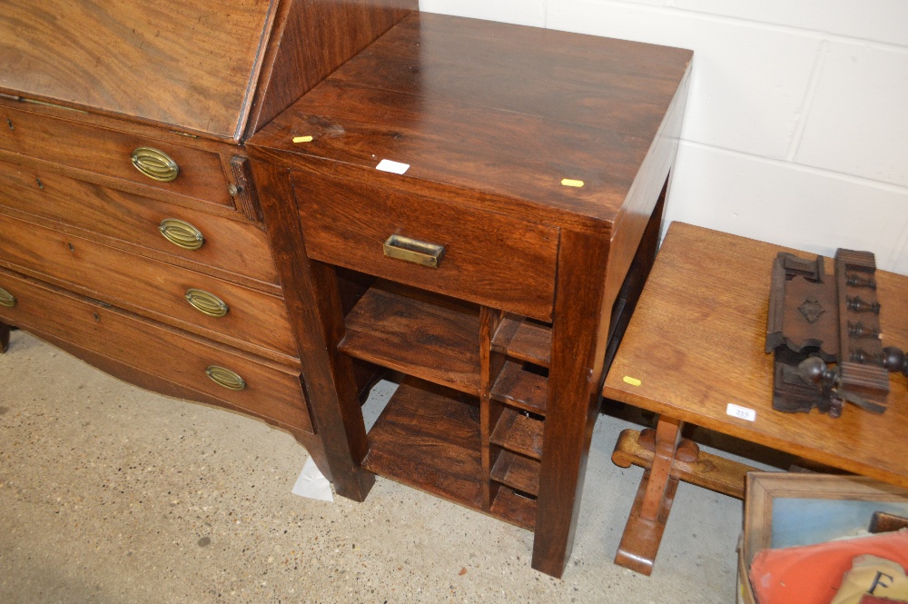 A hardwood side table with integral wine rack