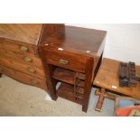 A hardwood side table with integral wine rack